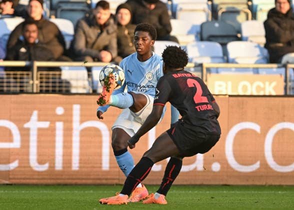 Manchester, England, 25th November 2025. Ryan McAidoo of Manchester City controls the ball during the Manchester City U19 vs Bayer Leverkusen U19 UEFA Youth League match at the Academy Stadium, Manchester. Picture credit should read: Cody Froggatt Sportimage EDITORIAL USE ONLY. No use with unauthorised audio, video, data, fixture lists, club league logos or live services. Online in-match use limited to 120 images, no video emulation. No use in betting, games or single club league player publications. SPI_007_CF_MANCHESTER_CITY_U19_V_BAYER_LEVERKUSEN_U19 SPI-4326-0007