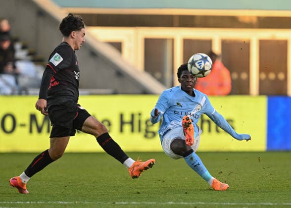 Manchester, England, 25th November 2025. Ryan McAidoo of Manchester City shoots towards goal during the Manchester City U19 vs Bayer Leverkusen U19 UEFA Youth League match at the Academy Stadium, Manchester. Picture credit should read: Cody Froggatt Sportimage EDITORIAL USE ONLY. No use with unauthorised audio, video, data, fixture lists, club league logos or live services. Online in-match use limited to 120 images, no video emulation. No use in betting, games or single club league player publications. SPI_009_CF_MANCHESTER_CITY_U19_V_BAYER_LEVERKUSEN_U19 SPI-4326-0009