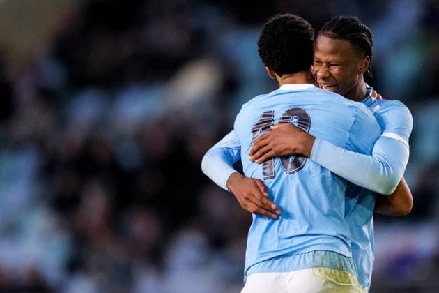 MANCHESTER, ENGLAND - NOVEMBER 25: Divine Mukasa of Manchester City U19 celebrates with Stephen Mfuni of Manchester City U19 after scoring his team s second goal during the UEFA Youth League 2025 26 League match between Manchester City U19 and Bayer 04 Leverkusen U19 at Joie Stadium on November 25, 2025 in Manchester, England. (Photo by Rene Nijhuis) SPO  Copyright: xRenexNijhuis
