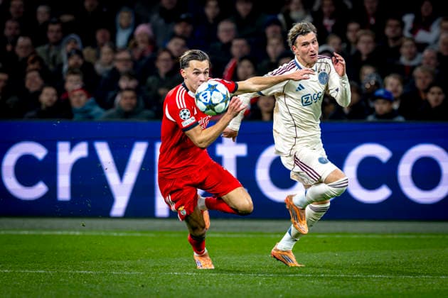 SL Benfica defender Amar Dedic, AFC Ajax Amsterdam forwarder Mika Godts during the match FOOTBALL CHAMPIONS LEAGUE AJAX vs BENFICA at the Johan Cruijff ArenA for the Champions League phase Matchday 5 season 2025 2026 in AMSTERDAM, Netherlands on 25 November 2025, photo by Stefan Koops EYE4images DeFodi Images