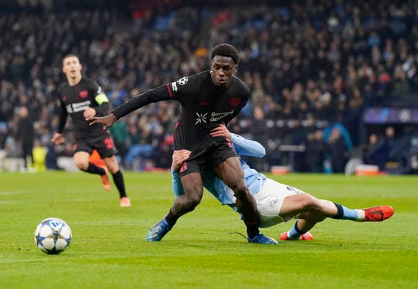 Manchester, England, 25th November 2025. Rayan Alt-Nouri of Manchester City (r) gets his hands on Ernest Poku of Bayer Leverkusen (l) during the Manchester City vs Bayer Leverkusen UEFA Champions League match at the Etihad Stadium, Manchester. Picture credit should read: Andrew Yates Sportimage EDITORIAL USE ONLY. No use with unauthorised audio, video, data, fixture lists, club league logos or live services. Online in-match use limited to 120 images, no video emulation. No use in betting, games or single club league player publications. SPI_026_AY_Man_City_Leverkusen SPI-4309-0040
