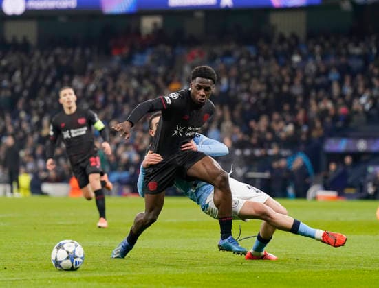 Manchester, England, 25th November 2025. Rayan Alt-Nouri of Manchester City (r) gets his hands on Ernest Poku of Bayer Leverkusen (l) during the Manchester City vs Bayer Leverkusen UEFA Champions League match at the Etihad Stadium, Manchester. Picture credit should read: Andrew Yates Sportimage EDITORIAL USE ONLY. No use with unauthorised audio, video, data, fixture lists, club league logos or live services. Online in-match use limited to 120 images, no video emulation. No use in betting, games or single club league player publications. SPI_028_AY_Man_City_Leverkusen SPI-4309-0042
