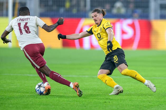 25 11 2025, Football, UEFA Champions League, Borussia Dortmund FC Villarreal, BVB Stadion, Matchday 5, Season 2025 2026 Thomas Partey FC Villarreal 16 in duel against Marcel Sabitzer BVB 20 Regulations prohibit any use of photographs as image sequences and or quasi video Nordrhein Westfalen Germany
