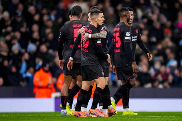 MANCHESTER, ENGLAND - NOVEMBER 25: Alejandro Grimaldo of Bayer 04 Leverkusen celebrates with Aleix Garcia of Bayer 04 Leverkusen after scoring his team s first goal during the UEFA Champions League 2025 26 League Phase MD5 match between Manchester City and Bayer 04 Leverkusen at City of Manchester Stadium on November 25, 2025 in Manchester, England. (Photo by Rene Nijhuis) SPO  Copyright: xRenexNijhuis