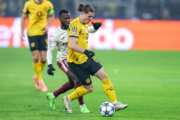 25 11 2025, Football, UEFA Champions League, Borussia Dortmund FC Villarreal, BVB Stadion, Matchday 5, Season 2025 2026 Nicolas Pepe FC Villarreal 19 in duel against Marcel Sabitzer BVB 20 Regulations prohibit any use of photographs as image sequences and or quasi video Nordrhein Westfalen Germany