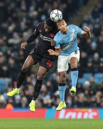 UEFA Champions League Matchday 5 of 8 Manchester City v Bayer 04 Leverkusen Christian Kofane of Bayer 04 Leverkusen and Nathan Ake of Manchester City battle for the ball during the UEFA Champions League Matchday 5 of 8 Manchester City v Bayer 04 Leverkusen at City of Manchester Stadium, Manchester, United Kingdom, 25th November 2025 (Photo by Mark Cosgrove News Images) Manchester City of Manchester Stadium Manchester United, ManU Kingdom Copyright: xMarkxCosgrove NewsxImagesx