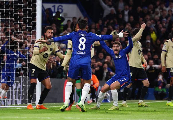 London, England, 25th November 2025. Pedro Neto of Chelsea hits the ball towards goal as Jules Kounde of FC Barcelona, Barca scores an own goal during the Chelsea vs FC Barcelona UEFA Champions League match at Stamford Bridge, London. Picture credit should read: Paul Terry Sportimage EDITORIAL USE ONLY. No use with unauthorised audio, video, data, fixture lists, club league logos or live services. Online in-match use limited to 120 images, no video emulation. No use in betting, games or single club league player publications. SPI_050_PT_Chelsea_Barcelona SPI-4310-0050