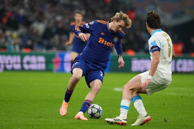 Nick Woltemade of Newcastle takes on Leonardo Balerdi of Marseille Marseille v Newcastle United, UEFA Champions League, Group Stage, Football, Orange Velodrome, Marseille, France- 25 Nov 2025Marseille Orange Vélodrome France EDITORIAL USE ONLY No use with unauthorised audio, video, data, fixture lists, club league logos or live services. Online in-match use limited to 120 images, no video emulation. No use in betting, games or single club league player publications.  Copyright: xDavexWinter Shutterstockx 15918266db