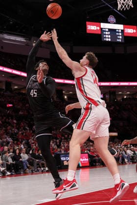 November 25, 2025, Columbus, Ohio, U.S: Mount St. Mary s Mountaineers guard Xavier Lipscomb (45) throws up a shot over Ohio State Buckeyes forward Brandon Noel (14) during the game between the Mount Saint MaryÃ¢â‚¬â ¢s Mountaineers and the Ohio State Buckeyes at Value City Arena, Columbus, Ohio. Columbus U.S - ZUMAs304 20251125_zaf_s304_042 Copyright: xScottxStuartx