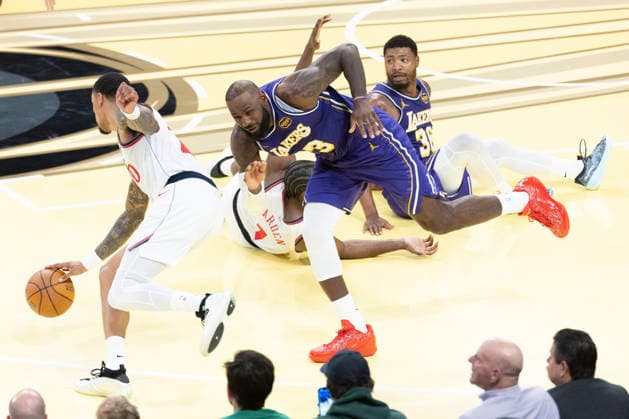 November 25, 2025, Los Angeles, California, USA: Los Angeles Clippers John Collins (20) drives past Los Angeles LakersÃ¢â‚¬â ¢ LeBron James (23) during an NBA, Basketball Herren, USA basketball game, in Los Angeles Tuesday, Nov. 25, 2025. Los Angeles USA - ZUMAc68_ 20251125_zaf_c68_029 Copyright: xRingoxChiux