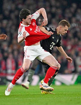 26 11 2025, Football UEFA Championsleague 2025 2026 Preliminary Round 5 Matchday, FC Arsenal FC Bayern Munich, at Emirates Stadium London England v l Declan Rice FC Arsenal v Joshua Kimmich FC Bayern Munich DFL and DFB regulations prohibit any use of photographs as image sequences and or quasi video