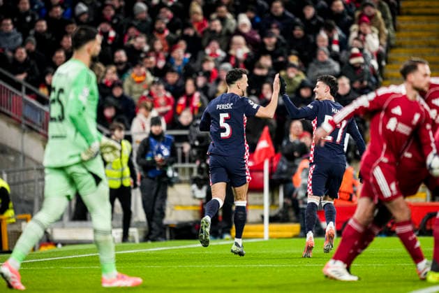 LIVERPOOL, ENGLAND - NOVEMBER 26: Ivan Perisic of PSV celebrates with Dennis Man of PSV after scoring his teams first goal during the UEFA Champions League 2025 26 League Phase MD5 match between Liverpool FC and PSV Eindhoven at Anfield on November 26, 2025 in Liverpool, England. (Photo by Rene Nijhuis) SPO  Copyright: xRenexNijhuis