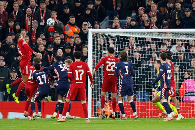 Liverpool, England, 26th November 2025. Virgil van Dijk of Liverpool heads the ball at goal which hits the cross bar during the Liverpool vs PSV Eindhoven UEFA Champions League match at Anfield, Liverpool. Picture credit should read: James Baylis Sportimage EDITORIAL USE ONLY. No use with unauthorised audio, video, data, fixture lists, club league logos or live services. Online in-match use limited to 120 images, no video emulation. No use in betting, games or single club league player publications. SPI_038_JB_Liverpool_PSV SPI-4311-0038