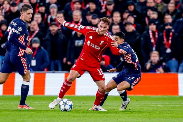 Alexis Mac Allister of Liverpool FC dribbles with the ball under pressure from Mauro Junior of PSV Eindhoven Liverpool FC v PSV Eindhoven, UEFA Champions League 2025 26 League Phase MD5, Liverpool FC v PSV Eindhoven, Anfield, November 26, 2025, Liverpool, United Kingdom.