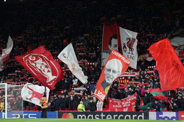 Liverpool, England, 26th November 2025. Liverpool fans wave flags during the Liverpool vs PSV Eindhoven UEFA Champions League match at Anfield, Liverpool. Picture credit should read: James Baylis Sportimage EDITORIAL USE ONLY. No use with unauthorised audio, video, data, fixture lists, club league logos or live services. Online in-match use limited to 120 images, no video emulation. No use in betting, games or single club league player publications. SPI_047_JB_Liverpool_PSV SPI-4311-0047