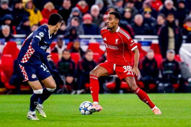 Ryan Gravenberch of Liverpool FC dribbles with the ball under pressure from Mauro Junior of PSV Eindhoven Liverpool FC v PSV Eindhoven, UEFA Champions League 2025 26 League Phase MD5, Liverpool FC v PSV Eindhoven, Anfield, November 26, 2025, Liverpool, United Kingdom.