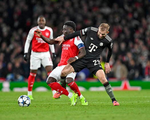 26 11 2025, Football UEFA Championsleague 2025 2026 Preliminary Round 5 Matchday, FC Arsenal FC Bayern Munich, at Emirates Stadium London England v l Bukayo Saka FC Arsenal v Konrad Laimer FC Bayern Munich DFL and DFB regulations prohibit any use of photographs as image sequences and or quasi video