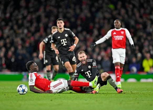 26 11 2025, Football UEFA Championsleague 2025 2026 Preliminary Round 5 Matchday, FC Arsenal FC Bayern Munich, at Emirates Stadium London England v l Bukayo Saka FC Arsenal v Konrad Laimer FC Bayern Munich DFL and DFB regulations prohibit any use of photographs as image sequences and or quasi video
