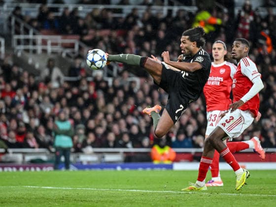 Serge Gnabry Bayern Muenchen and Cristhian Mosquera Arsenal FC battle for the ball during the UEFA Champions League 2025 26 League Phase MD5 match between Arsenal FC and FC Bayern München at Arsenal Stadium on November 26, 2025 in London, United Kingdom Photo by Harry Langer DeFodi Images