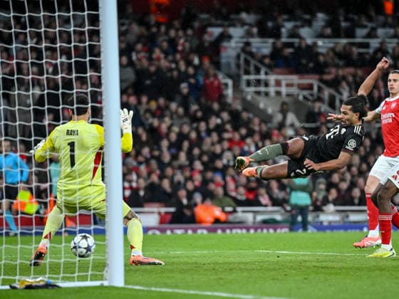 Goalkeeper David Raya Arsenal FC and Serge Gnabry Bayern Muenchen battle for the ball during the UEFA Champions League 2025 26 League Phase MD5 match between Arsenal FC and FC Bayern München at Arsenal Stadium on November 26, 2025 in London, United Kingdom Photo by Harry Langer DeFodi Images