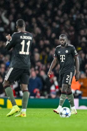 Kingsley Coman Bayern Muenchen and Dayot Upamecano Bayern Muenchen look dejected during the UEFA Champions League 2025 26 League Phase MD5 match between Arsenal FC and FC Bayern München at Arsenal Stadium on November 26, 2025 in London, United Kingdom Photo by Harry Langer DeFodi Images