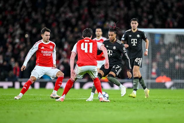 Martin Zubimendi Arsenal FC , Declan Rice Arsenal FC and Michael Olise Bayern Munich battle for the ball during the UEFA Champions League 2025 26 League Phase MD5 match between Arsenal FC and FC Bayern Munich at Arsenal Stadium on November 26, 2025 in London, United Kingdom Photo by Harry Langer DeFodi Images
