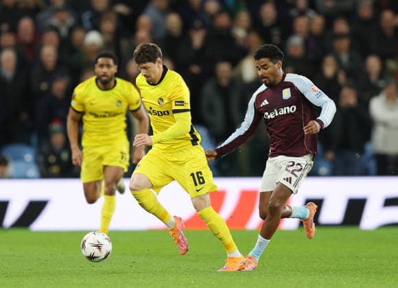 Birmingham, England, 27th November 2025. Christian Fassnacht of Young Boys (l) and Ian Maatsen of Aston Villa (r) during the Aston Villa vs Young Boys UEFA Europa League match at Villa Park, Birmingham. Picture credit should read: James Baylis Sportimage EDITORIAL USE ONLY. No use with unauthorised audio, video, data, fixture lists, club league logos or live services. Online in-match use limited to 120 images, no video emulation. No use in betting, games or single club league player publications. SPI_017_JB_Villa_YoungBoys SPI-4329-0013