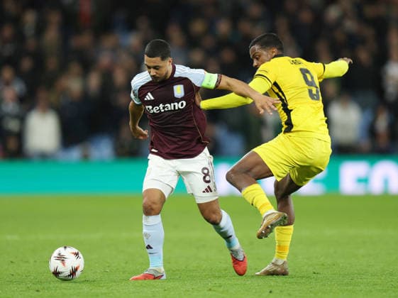 Birmingham, England, 27th November 2025. Youri Tielemans of Aston Villa tackled by Sergio Cordova of Young Boys during the Aston Villa vs Young Boys UEFA Europa League match at Villa Park, Birmingham. Picture credit should read: James Baylis Sportimage EDITORIAL USE ONLY. No use with unauthorised audio, video, data, fixture lists, club league logos or live services. Online in-match use limited to 120 images, no video emulation. No use in betting, games or single club league player publications. SPI_021_JB_Villa_YoungBoys SPI-4329-0019