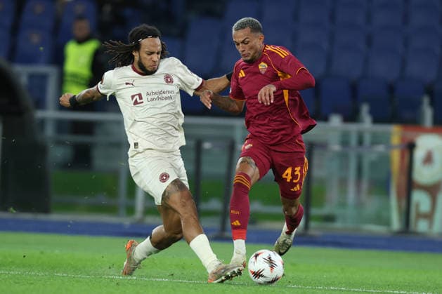 Football: Uefa Europa League 2025 2026 - As Roma vs FC Midtjylland at OLYMPIC STADIUM in Rome. Rome, Italy - November 27, 2025: Wesley Franca of Roma, Kevin Mbabu of Midtjylland seen in action during the Uefa Europa League 2025 2026, football match - day 5 - As Roma vs FC Midtjylland at OLYMPIC STADIUM in Rome. ROME OLYMPIC STADIUM italy italy Copyright: xmarcoxiacobucci