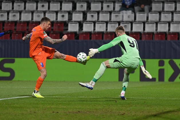 L-R Franko Kovacevic (Celje) and goalkeeper Jan Koutny (Olomouc) in action during the Football UEFA Conference League, 4th round match: Sigma Olomouc vs NK Celje in Olomouc, Czech Republic, November 27, 2025. (CTKxPhoto LudekxPerina) CTKPhotoP2025112707118  CTKPhotoP2025112707118