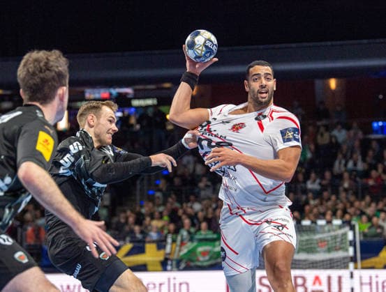 Handball, Men, Season 2025 2026, Champions League Group A, Matchday 9 , Füchse Berlin One Veszprem HC, v l Hakun West Av Teigum Füchse Berlin , Mathias Gidsel Füchse Berlin , Ahmed Hesham Elsayed Moham Veszprem , 27 11 2025, Copyright: xSebastianxRäppold MatthiasxKochx