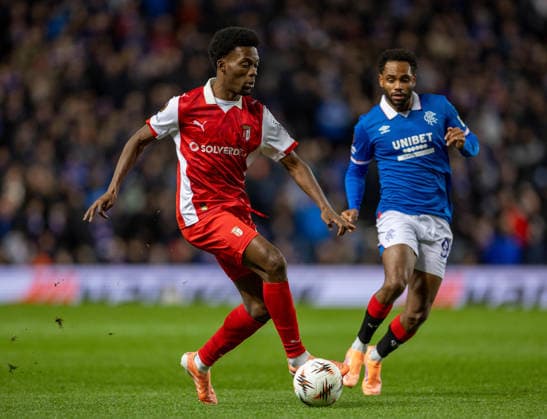 27th November 2025; Ibrox Stadium, Glasgow, Scotland; UEFA Europa League Football, Rangers versus Braga; Gorby Baptiste of SC Braga dribbles past Danilo of Rangers  VagelisxGeorgariou