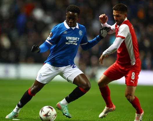 Djeidi Gassama of Rangers and Joao Moutinho of Braga during the Europa League league phase match at Ibrox Stadium, Glasgow. Rangers v Braga - UEFA Europa League - League Phase - Ibrox Stadium, Glasgow, Lanarkshire, Scotland, UK - 27 Nov 2025Glasgow Ibrox Lanarkshire United Kingdom  Copyright: xO Rourke RangersxFC Shutterstockx 15953532t