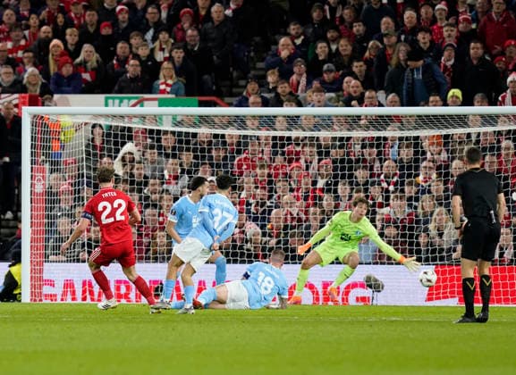 Nottingham, England, 27th November 2025. Ryan Yates of Nottingham Forest (l) scores the first goal past Melker Ellborg of Malmo FF during the Nottingham Forest vs Malmo UEFA Europa League match at the City Ground, Nottingham. Picture credit should read: Andrew Yates Sportimage EDITORIAL USE ONLY. No use with unauthorised audio, video, data, fixture lists, club league logos or live services. Online in-match use limited to 120 images, no video emulation. No use in betting, games or single club league player publications. SPI_022_AY_Forest_Malmo SPI-4328-0029