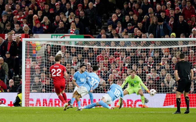 Nottingham, England, 27th November 2025. Ryan Yates of Nottingham Forest (l) scores the first goal past Melker Ellborg of Malmo FF during the Nottingham Forest vs Malmo UEFA Europa League match at the City Ground, Nottingham. Picture credit should read: Andrew Yates Sportimage EDITORIAL USE ONLY. No use with unauthorised audio, video, data, fixture lists, club league logos or live services. Online in-match use limited to 120 images, no video emulation. No use in betting, games or single club league player publications. SPI_024_AY_Forest_Malmo SPI-4328-0031