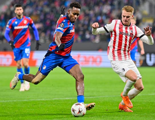 L-R Sampson Dweh (Viktoria) and Philipp Lienhart (Freiburg) in action during the Football Europa League, 5th round match: FC Viktoria Plzen vs SC Freiburg in Pilsen, Czech Republic, November 27, 2025. (CTKxPhoto MiroslavxChaloupka) CTKPhotoP2025112708074  CTKPhotoP2025112708074