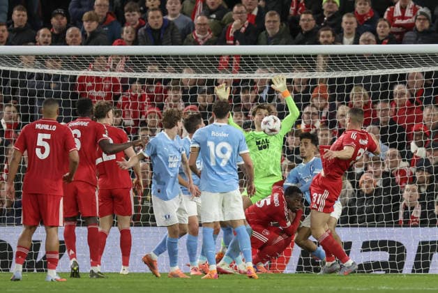 Nottingham Forest v Malmo FF Europa League 27 11 2025. Melker Ellborg of Malmo saves a header from Nikola Milenkovic of Nottingham Forest during the Europa League match between Nottingham Forest and Malmo FF at the City Ground, Nottingham, England on 27 November 2025. Editorial use only , Copyright: xJezxTighex PSI-23286-0037