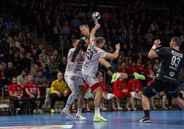 Handball, Men, Season 2025 2026, Champions League Group A, Matchday 9 , Füchse Berlin One Veszprem HC, v l Ahmed Hesham Elsayed Moham Veszprem , Mathias Gidsel Füchse Berlin , Patrik Ligetvari Veszprem , Mijajlo Marsenic Füchse Berlin , 27 11 2025, Copyright: xSebastianxRäppold MatthiasxKochx