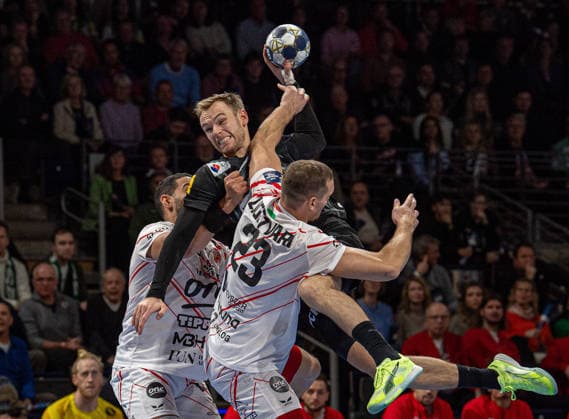 Handball, Men, Season 2025 2026, Champions League Group A, Matchday 9 , Füchse Berlin One Veszprem HC, v l Ahmed Hesham Elsayed Moham Veszprem , Mathias Gidsel Füchse Berlin , Patrik Ligetvari Veszprem , 27 11 2025, Copyright: xSebastianxRäppold MatthiasxKochx