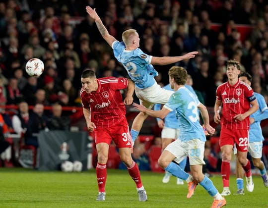 Nottingham, England, 27th November 2025. Nikola Milenkovic of Nottingham Forest and Daniel Gudjohsen of Malmo FF during the Nottingham Forest vs Malmo UEFA Europa League match at the City Ground, Nottingham. Picture credit should read: Andrew Yates Sportimage EDITORIAL USE ONLY. No use with unauthorised audio, video, data, fixture lists, club league logos or live services. Online in-match use limited to 120 images, no video emulation. No use in betting, games or single club league player publications. SPI_026_AY_Forest_Malmo SPI-4328-0033