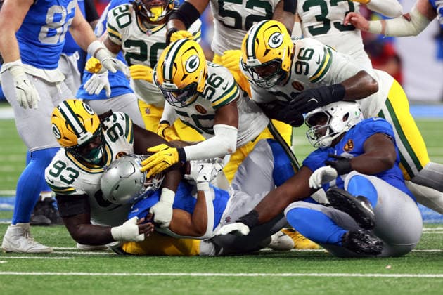 Detroit Lions DETROIT,MICHIGAN-November27: Running back David Montgomery (5) of the Detroit Lions is tackled by defensive tackle Nazir Stackhouse (93) of the Green Bay Packers, linebacker Edgerrin Cooper (56) of the Green Bay Packers and defensive tackle Colby Wooden (96) of the Green Bay Packers during an NFL, American Football Herren, USA football game between the Green Bay Packers and the Detroit Lions in Detroit, Michigan USA, on Sunday, November 23, 2025. Detroit Michigan United States  Copyright: xAmyxLemusx originalFilename:lemus-newyorkg251127_np5cM.jpg