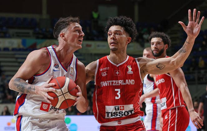(251128) -- BELGRADE, Nov. 28, 2025 -- Switzerland s Yoan Granvorka (front R) defends Serbia s Danilo Andjusic (front L) during the FIBA basketball World Cup 2027 European qualifiers first round group C match between Serbia and Switzerland in Belgrade, Serbia, Nov. 27, 2025. (Photo by Xinhua) (SP)SERBIA-BELGRADE-BASKETBALL-FIBA-WORLD CUP-QUALIFIER-SERBIA VS SWITZERLAND PredragxMilosavljevic 