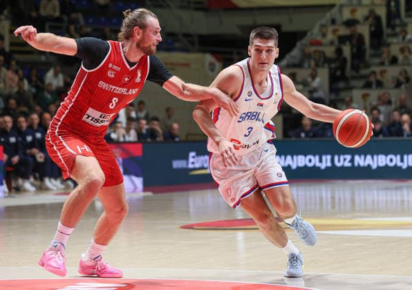 (251128) -- BELGRADE, Nov. 28, 2025 -- Serbia s Stefan Miljenovic (L) defends Switzerland s Toni Rocak during the FIBA basketball World Cup 2027 European qualifiers first round group C match between Serbia and Switzerland in Belgrade, Serbia, Nov. 27, 2025. (Photo by Xinhua) (SP)SERBIA-BELGRADE-BASKETBALL-FIBA-WORLD CUP-QUALIFIER-SERBIA VS SWITZERLAND PredragxMilosavljevic 