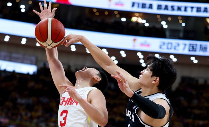 (251128) -- BEIJING, Nov. 28, 2025 -- An Youngjun (R) of South Korea vies with Hu Mingxuan of China during the Group B match at the FIBA Basketball World Cup Asian Qualifiers in Beijing, capital of China, Nov. 28, 2025. ) (SP)CHINA-BEIJING-BASKETBALL-FIBA WORLD CUP 2025 ASIAN QUALIFIERS-CHN VS KOR (CN) WangxKaiyan 