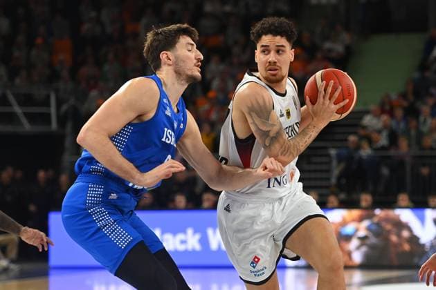 Joshua Obiesie GER , action,duel against Roman Sorkin ISR Basketball international World Cup qualifier Germany GER Israel ISR on 28 11 2025 rtiopharm Arena Neu Ulm