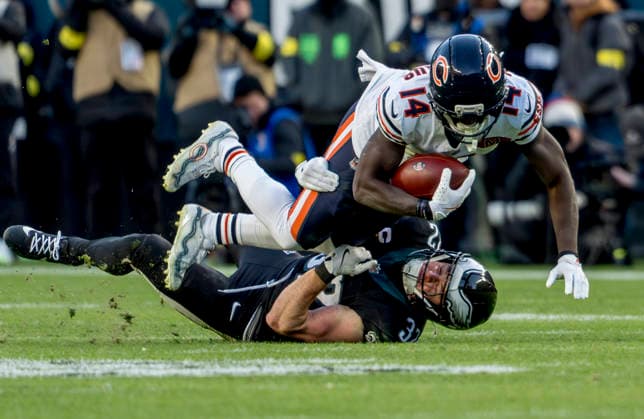 November 28, 2025, Philadelphia, Pennsylvania, USA: Chicago Bears wide receiver OLAMIDE ZACCHEAUS (14) is tackled by Philadelphia Eagles safety REED BLANKENSHIP (32) after a catch during the NFL, American Football Herren, USA football matchup between the Chicago Bears and the Philadelphia Eagles at Lincoln Financial Field in Philadelphia. Philadelphia USA - ZUMAcs17 20251128_faf_cs17_016 Copyright: xScottxSeriox