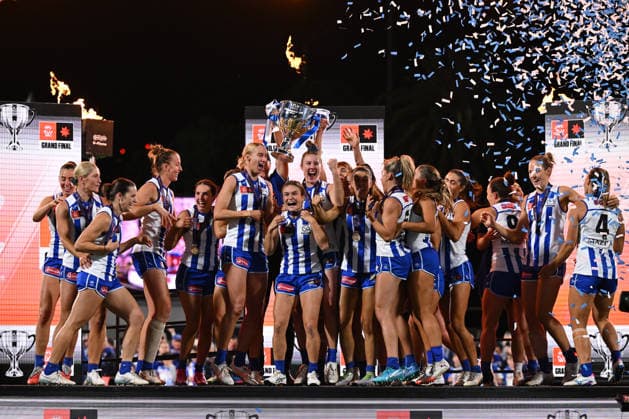 AFLW GRAND FINAL, Kangaroos players and Darren Crocker, Senior Coach of the Kangaroos celebrate on stage with the trophy after defeating the Brisbane Lions to win the AFLW Grand Final match between the North Melbourne Kangaroos and the Brisbane Lions at Ikon Park in Melbourne, Saturday, November 29, 2025. ( NO ARCHIVING, EDITORIAL USE ONLY MELBOURNE VICTORIA AUSTRALIA  Copyright: xJAMESxROSSx 20251129191715950095