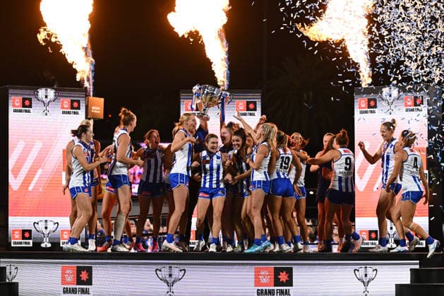 AFLW GRAND FINAL, Kangaroos players and Darren Crocker, Senior Coach of the Kangaroos celebrate on stage with the trophy after defeating the Brisbane Lions to win the AFLW Grand Final match between the North Melbourne Kangaroos and the Brisbane Lions at Ikon Park in Melbourne, Saturday, November 29, 2025. ( NO ARCHIVING, EDITORIAL USE ONLY MELBOURNE VICTORIA AUSTRALIA  Copyright: xJAMESxROSSx 20251129195171069592
