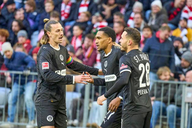 Andreas Hountondji of St.Pauli celebrates his her goal, happy, laugh, celebration, 0-1 with Mathias Pereira Lage of St.Pauli Jackson Irvine of St.Pauli in the match FC BAYERN MÜNCHEN - FC ST. PAULI on November 29, 2025 at Allianz Arena München, Germany. Season 2026 2026, 1.Bundesliga, FCB, matchday 12,