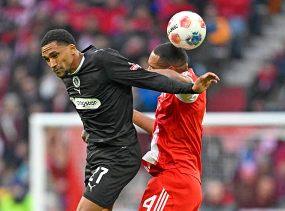 29 11 2025, Soccer Bundesliga 2025 2026, Matchday 12, FC Bayern Munich FC St Pauli, at the Allianz Arena Munich, v l AndreasÊHountondji FC St Pauli vs Jonathan Tah FC Bayern Munich DFL and DFB regulations prohibit any use of photographs as image sequences and or quasi video